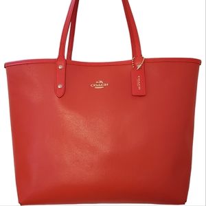 COACH Reversible City Tote in Coral Red with Monogram Signature F57669